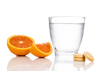 Glass of water with oranges and vitamin c effervescent tablet