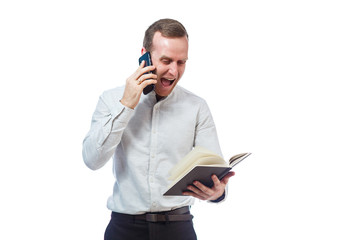 man businessman, teacher, mentor examines entries in your diary and talking on a cell phone....