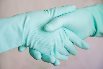 Handshake with medical gloves