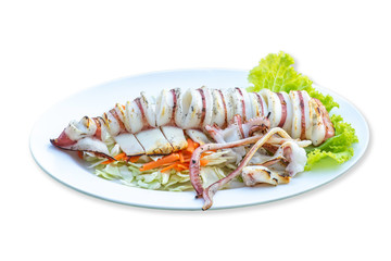 Isolated Grilled squid in vegetables in the plate on a white background with clipping path.