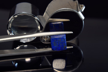 Fototapeta na wymiar Gem and Jewelry lapis lazuli As accessories At the blue