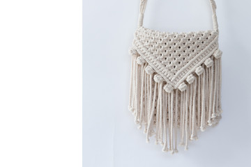 Handmade macrame on a white background.