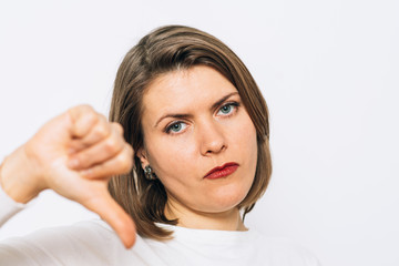 Woman showing a thumb down gesture