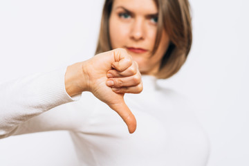 Woman showing a thumb down gesture