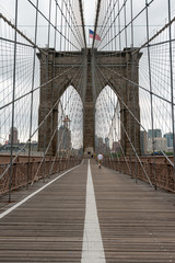 Landscape view of empty Brooklyn Bridge in New York City, empty streets due Covid-19 coronavirus pandemic, USA