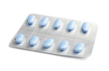 Blister pack with pills on white background
