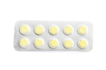 Blister pack with pills on white background