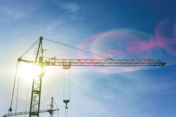 crane and scaffolding in the construction site. Construction high-rise building concepts.