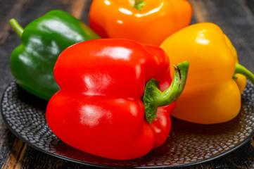 Fresh red, orange, green and yellow sweet bell paprika