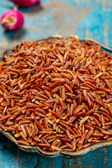 Bowl with wild long brown rice uncooked