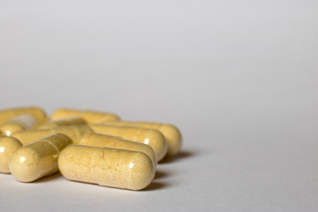 yellow pills scattered on the table