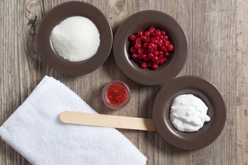 Ingredients for making a natural homemade scrub. Skin care. Sugar, cream, berries, salt. Moisturizing, exfoliating, peeling. Home Cosmetics, Spa Treatment, Aromatherapy, eco, vegan.