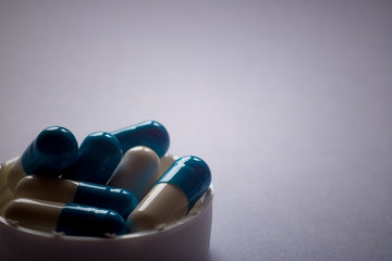 blue-white pills on a plain background