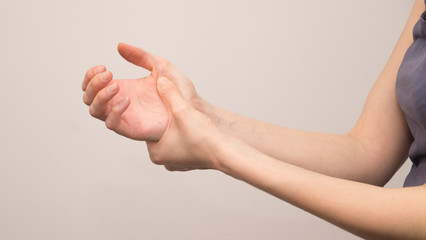 Parkinson's disease symptoms. Close up of tremor (shaking) hands of Middle-aged women patient with Parkinson's disease. Mental health and neurological disorders.