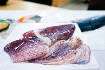 raw squid in the white plate