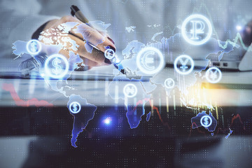 Double exposure of woman's hands making notes with forex graph hologram. Concept technical analysis.
