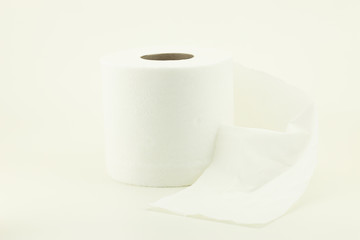 Roll of white toilet paper on white background