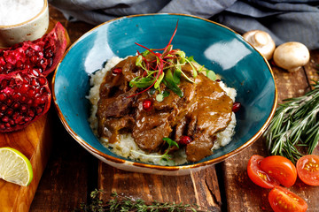 beef cheeks stewed in sauce with mashed potatoes