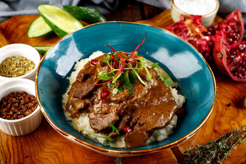 beef cheeks stewed in sauce with mashed potatoes