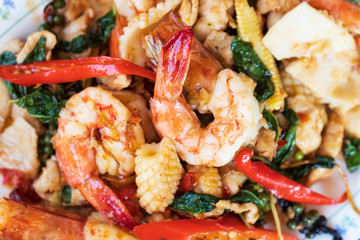 Selective focus of fried stir spicy sea food, Pad Cha Talay Sea Food, Thai food. Close up