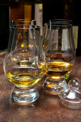 Tasting of flight of Scotch whisky from special tulip-shaped glasses on distillery in Scotland, UK