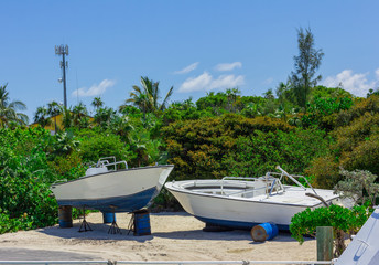 Two boats lie in the sand. Moored boats.