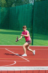 Female tennis player preparing to hit a forehand