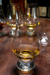 Tasting of flight of Scotch whisky from special tulip-shaped glasses on distillery in Scotland, UK