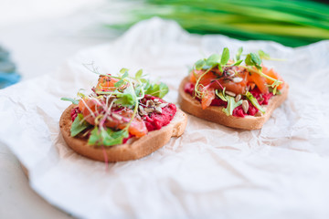 Tasty italian bruschetta on the wooden plate
