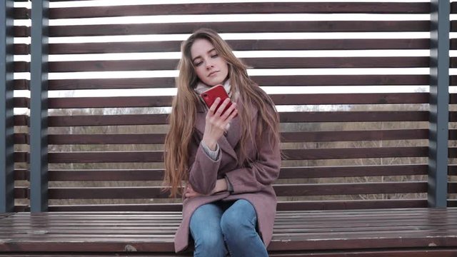 The young girl has cramps in her stomach and she is looking for medicine