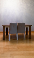 Modern seating arrangement with blank wall shot as a background for artists to insert their art...