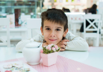 Child on table in confectionery