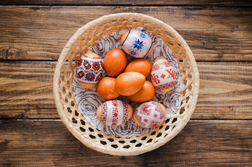 Delicious Easter eggs of guinea hen on a wooden background to the traditional Easter feast.