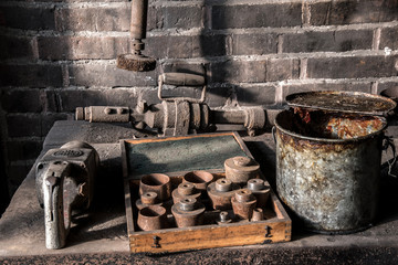 Rusty old bucket and tools used in mine
