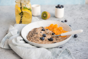 Vegetarian oatmeal porridge with Chia seeds and berries, healthy Breakfast concept