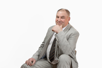 Portrait of a mature man in a gray jacket, businessman