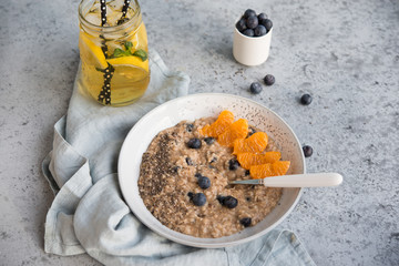 Vegetarian oatmeal porridge with Chia seeds and berries, healthy Breakfast concept