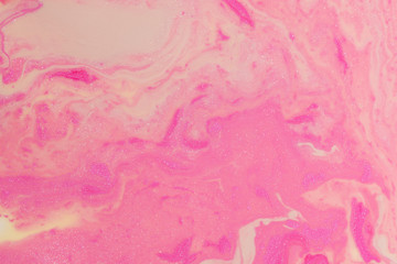 Fototapeta na wymiar Abstract background of mixed shades of nail polish with marbled