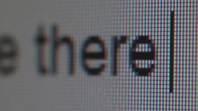 Typing the saying. Appearing of phrase on screen. Close up view.