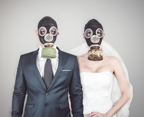 Wedding during the coronavirus period. Bride and groom in protective medical masks