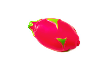 Pitaya. Toy plastic fruit isolated on white background. Plastic fruit for the game. Playing at the...