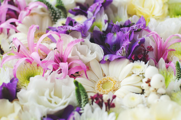 Lots of close-up flowers. Pink lilies, gerberas, white flowers, petals.