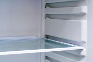 Empty refrigerator shelfs close up