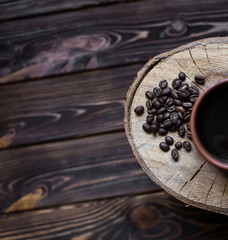 cup of coffee on a wooden background. Coffee, spoon, grain, wooden background.