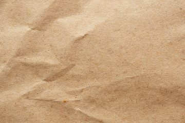 Brown crumpled paper recycled kraft sheet texture background