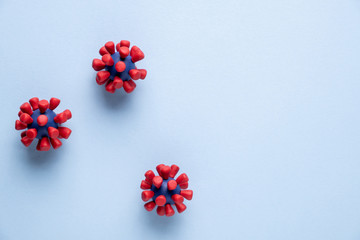 Plasticine model  of coronavirus bacteria .or  other virus  on blue background. Place fo text.