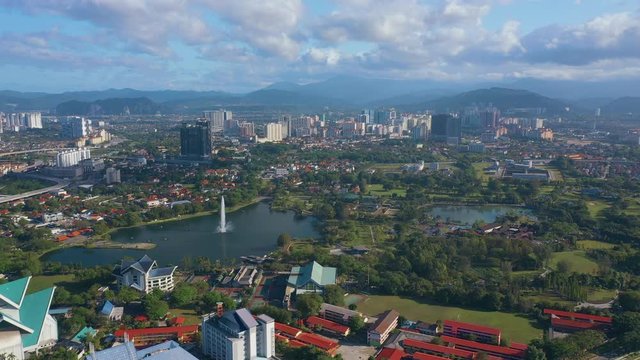 February 23rd, 2020 - Kuala Lumpur, Malaysia : 4k Establishing b-roll aerial shot of drone moving forward and flying over Titiwangsa Lake. Green and Sustainable City