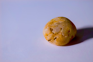 a  sharp shot of a stone with a blurred simple background