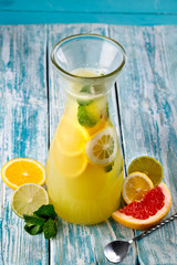 A glass of lemon soda with fresh mint