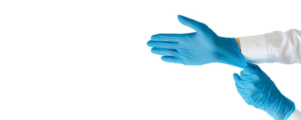 Hand in glove holding blue glove